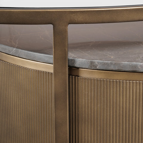 Bronze nesting table with ribbed texture and marble surface detail.