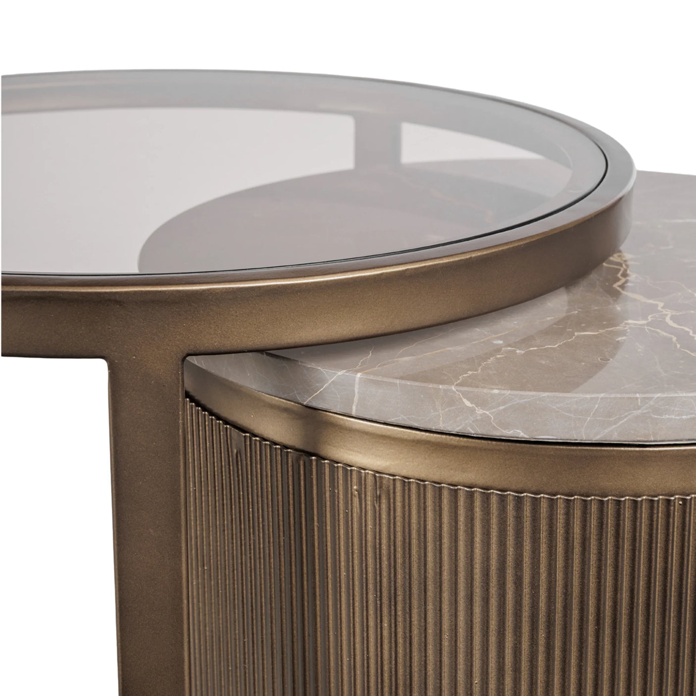 Gold nesting tables with glass top and marble texture detail.