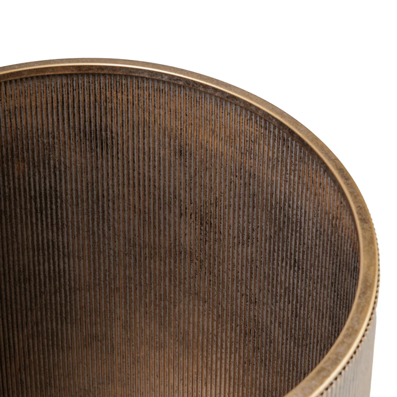 Bronze-toned shelving detail with vertical ribbed texture.