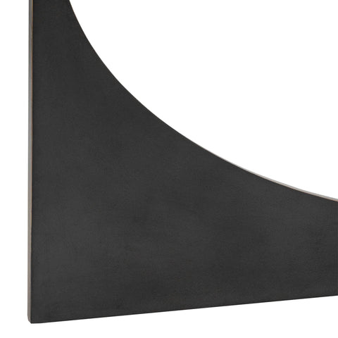 Black sculpted table leg with smooth finish detail.