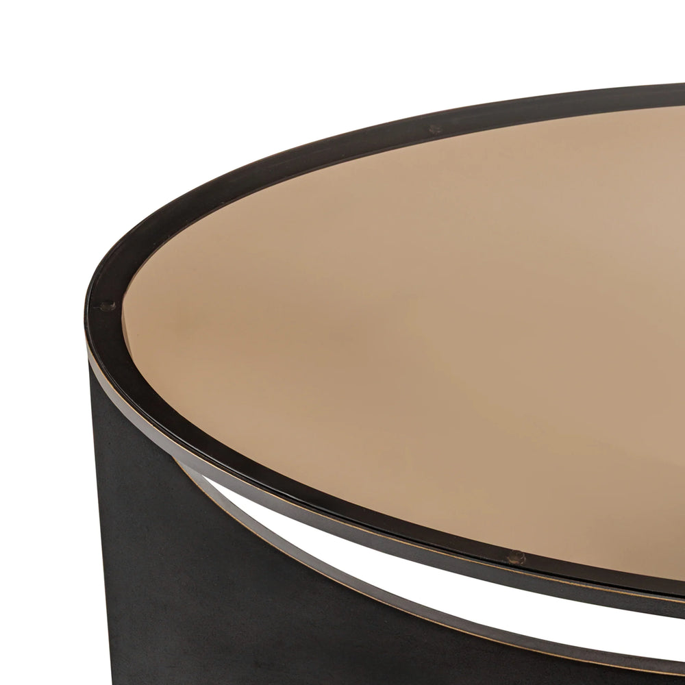 Black metal coffee table edge with smooth beige surface.