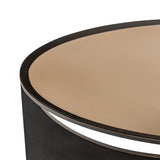 Black metal coffee table edge with smooth beige surface.