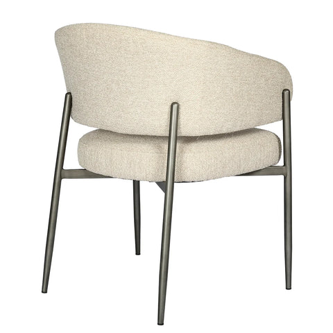 Beige boucle chair with curved back and sleek metal legs.