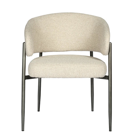 Cream boucle dining chair with curved backrest and metal legs.