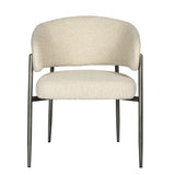 Cream boucle dining chair with curved backrest and metal legs.