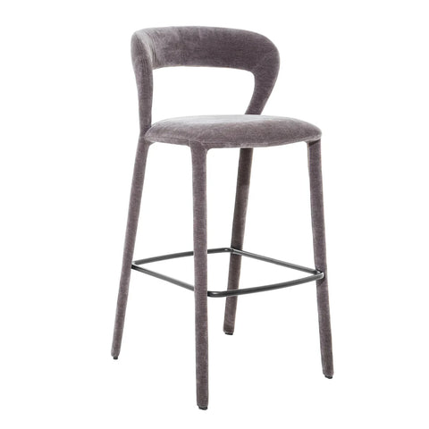 Grey upholstered bar stool with curved back and sleek metal footrest.