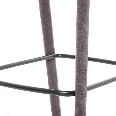 Grey fabric stool leg with black metal footrest detail.