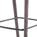 Grey fabric stool leg with black metal footrest detail.