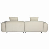 Back view of beige velvet sofa with plush cushions and rounded arms.