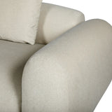 Warm stone velvet sofa arm with plush cushion detail.
