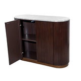 Dark wood cabinet with open door and marble top surface.
