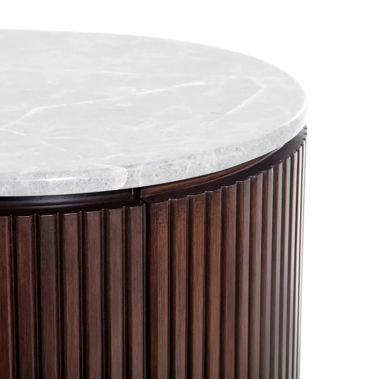 Dark wood chest with fluted texture and white marble top.