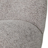 Beige chair fabric with textured woven detail.