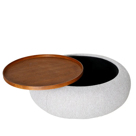 Oatmeal fabric ottoman with open wooden tray lid.