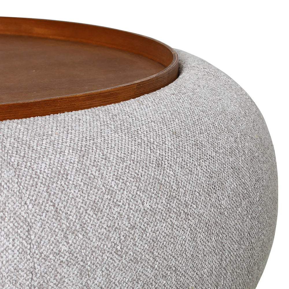 Oatmeal ottoman with textured fabric and wooden tray top.
