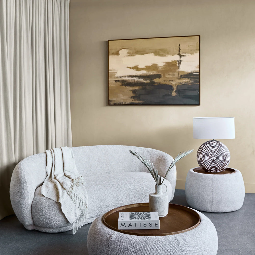 Oatmeal ottoman with wooden tray in modern living room setting.