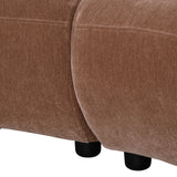 Mocha velvet sofa close-up showing smooth texture and rounded edges.