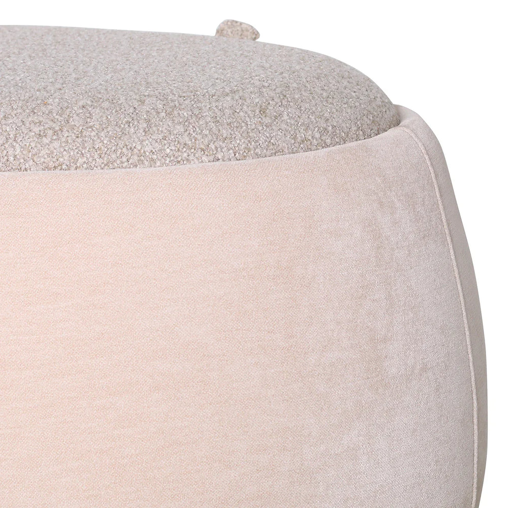 Beige storage bench with textured fabric detail on top.