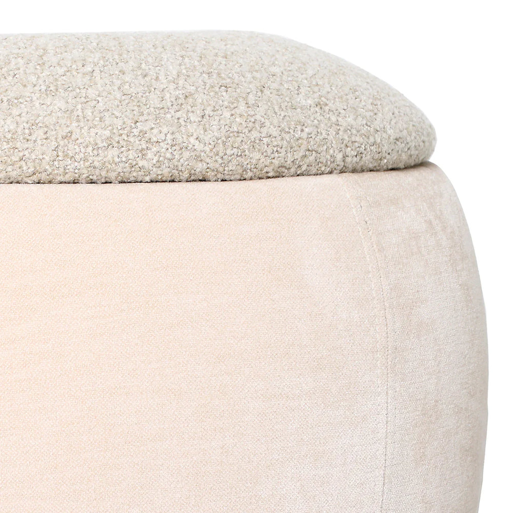 Beige stool with textured fabric top and smooth sides.