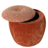 Terracotta stool with textured lid partially open, revealing storage space inside.