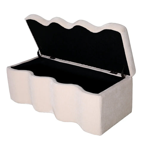 Cream fabric bench with wavy edges and open lid showing storage space.