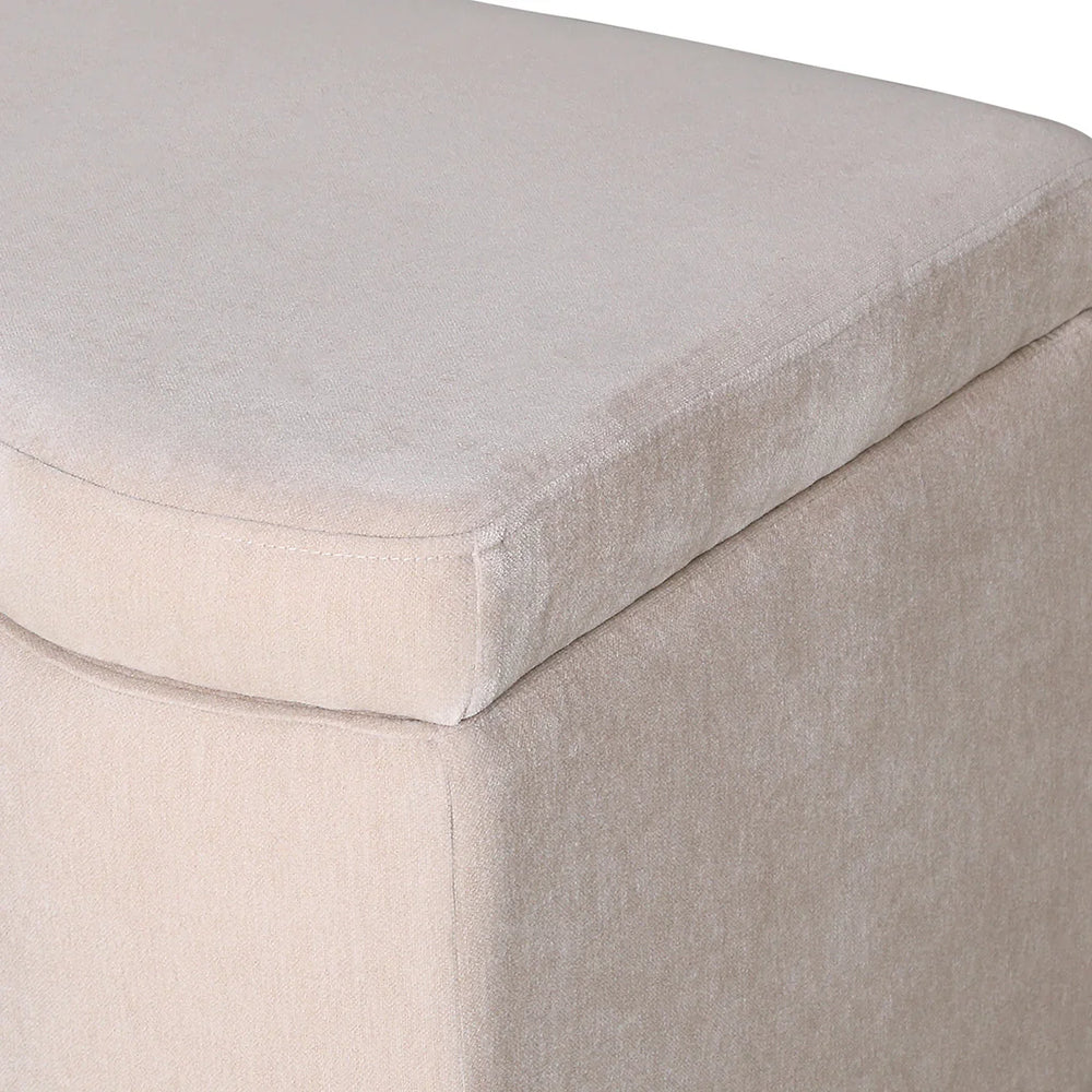 Beige fabric bench corner showing soft texture detail.