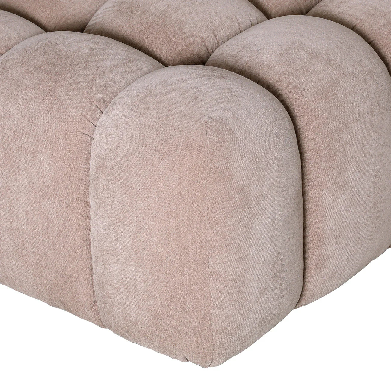 Beige pouf with tufted upholstery detail.