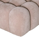 Beige pouf with tufted upholstery detail.