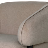 Beige chair armrest with soft, textured fabric detail.