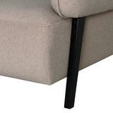 Beige fabric chair corner with black wooden leg detail.