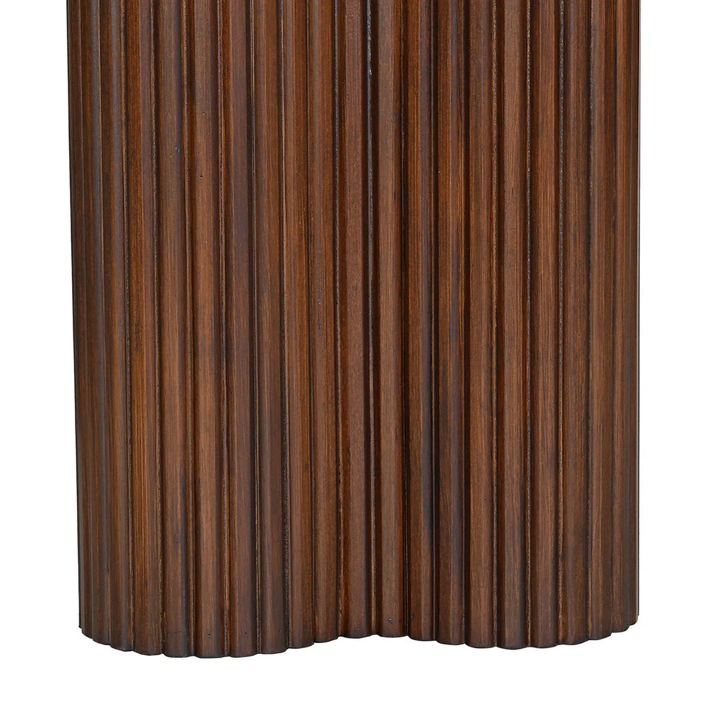 Dark wood console table showcasing vertical grooves