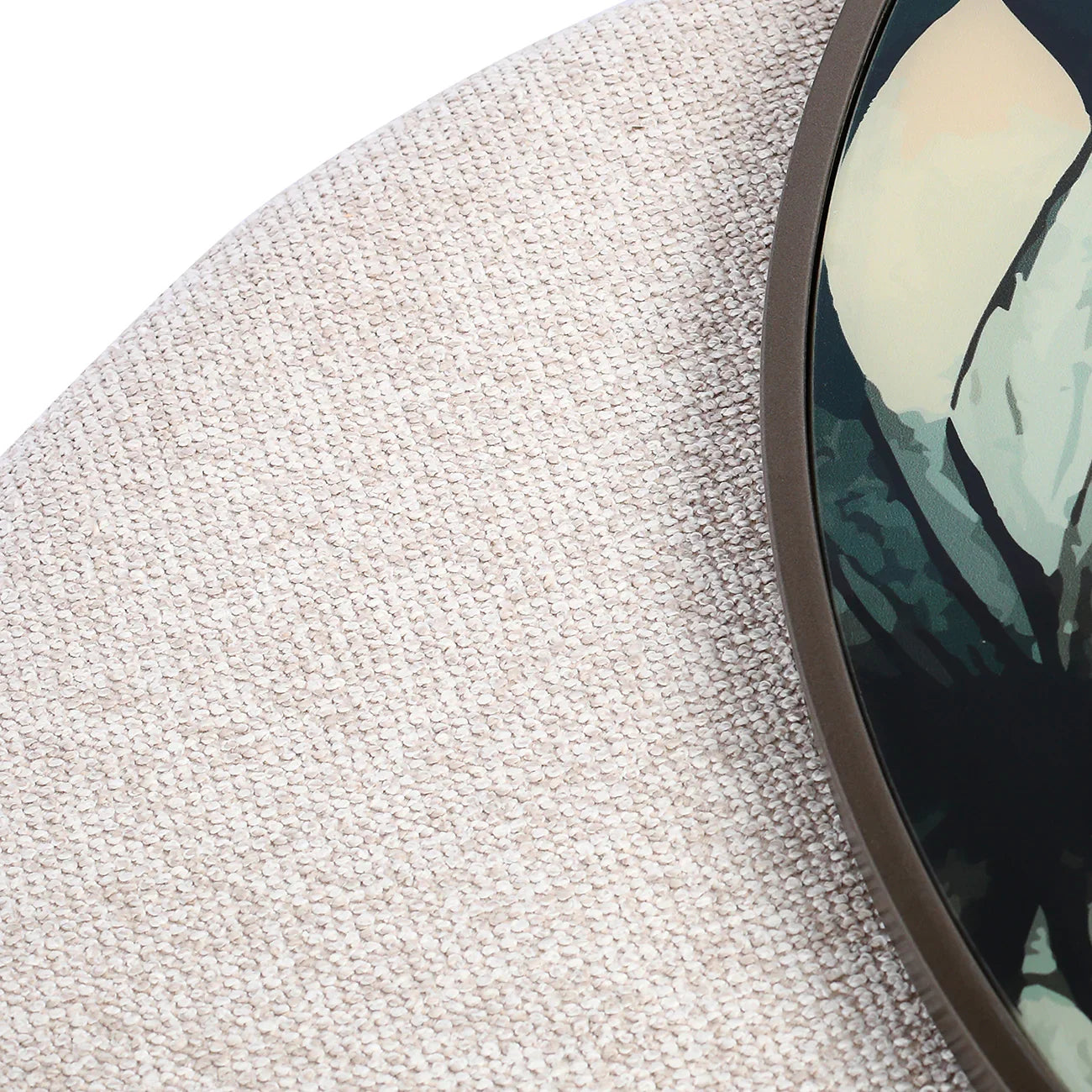 Textured beige fabric with dark framed leaf pattern detail.