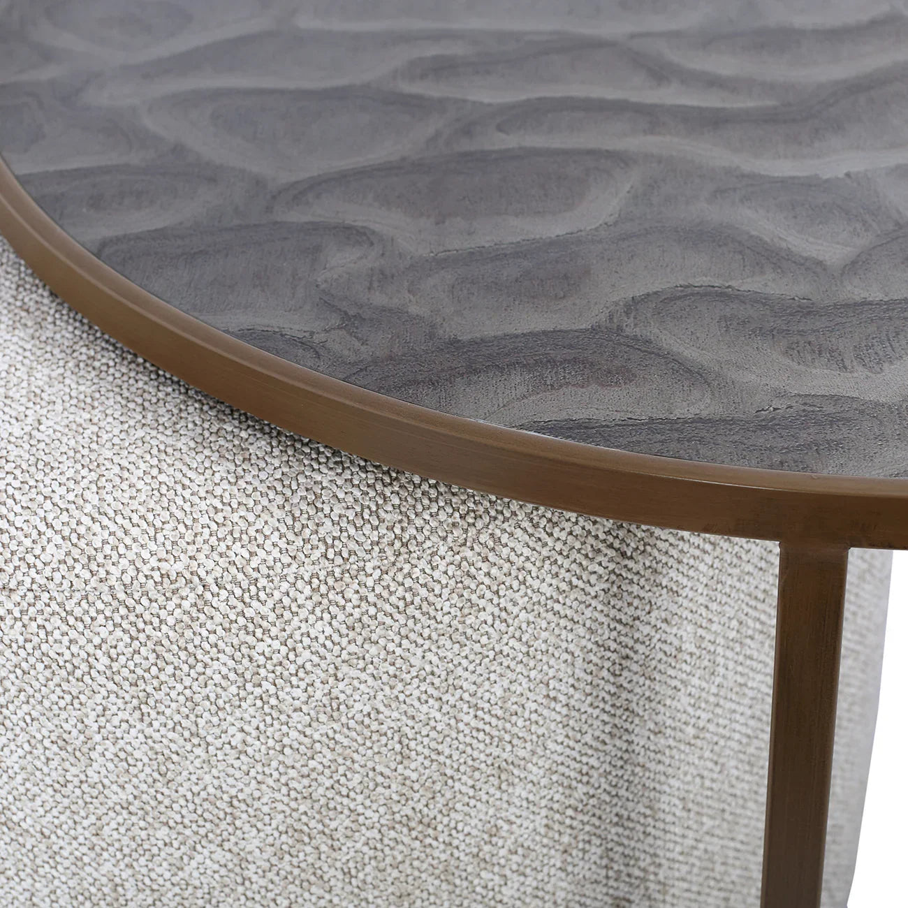 Dark wood tabletop with ripple texture and woven fabric detail underneath.
