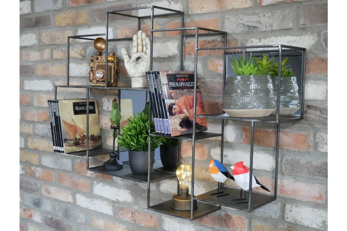 Industrial metal wall shelves set on brick wall with books, plants, decor and ornaments