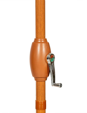 Brown parasol pole with metal crank handle for outdoor umbrella
