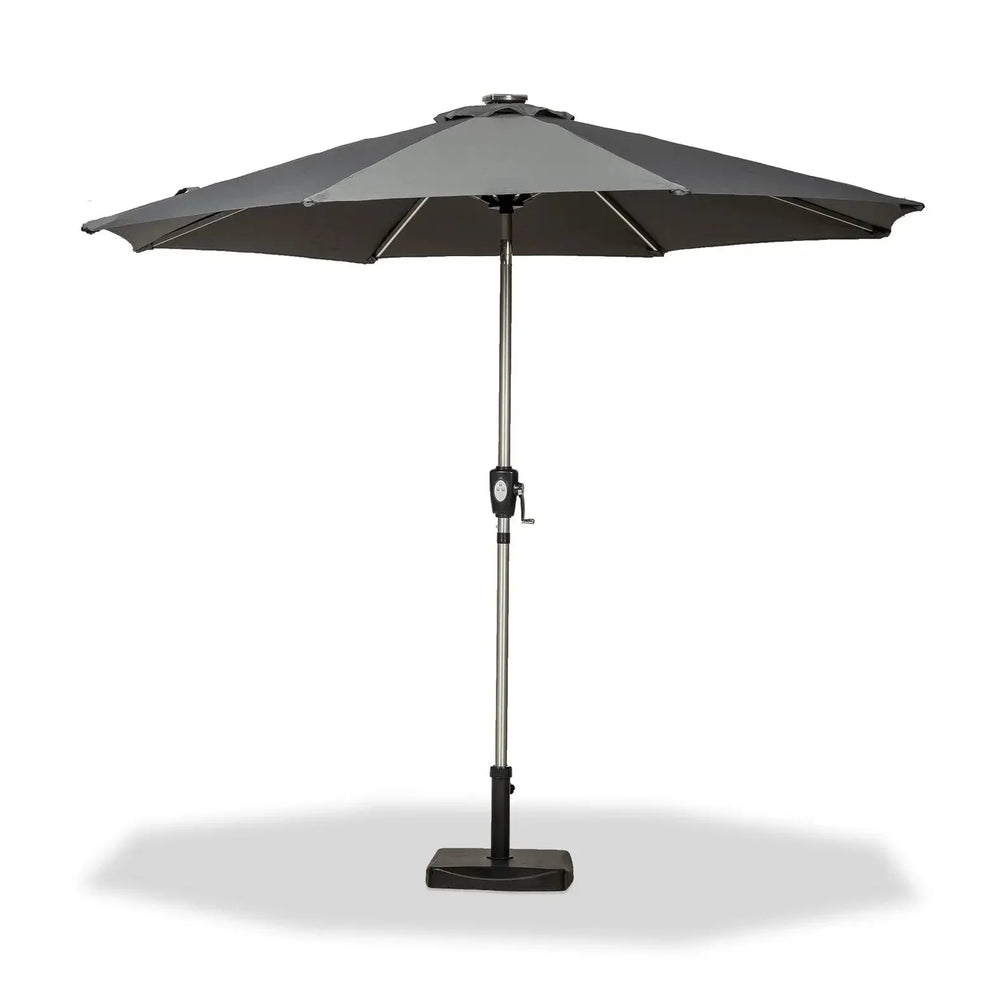 Grey outdoor garden parasol with metal pole and base, crank handle visible at center