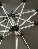 Close view of metal frame and support ribs on a grey garden parasol