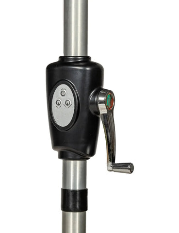 Manual crank handle and control panel on metal parasol pole close-up