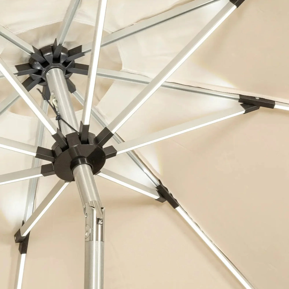 Close-up of beige garden parasol with metal frame and tilt mechanism