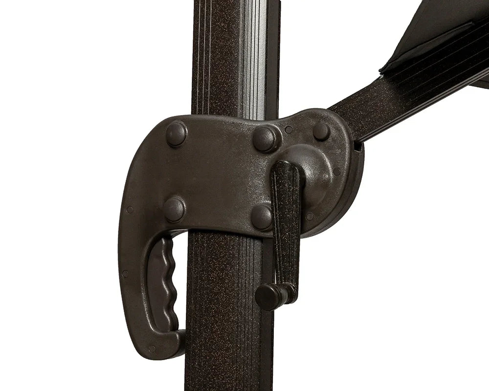 Close view of metal parasol crank mechanism on dark textured pole