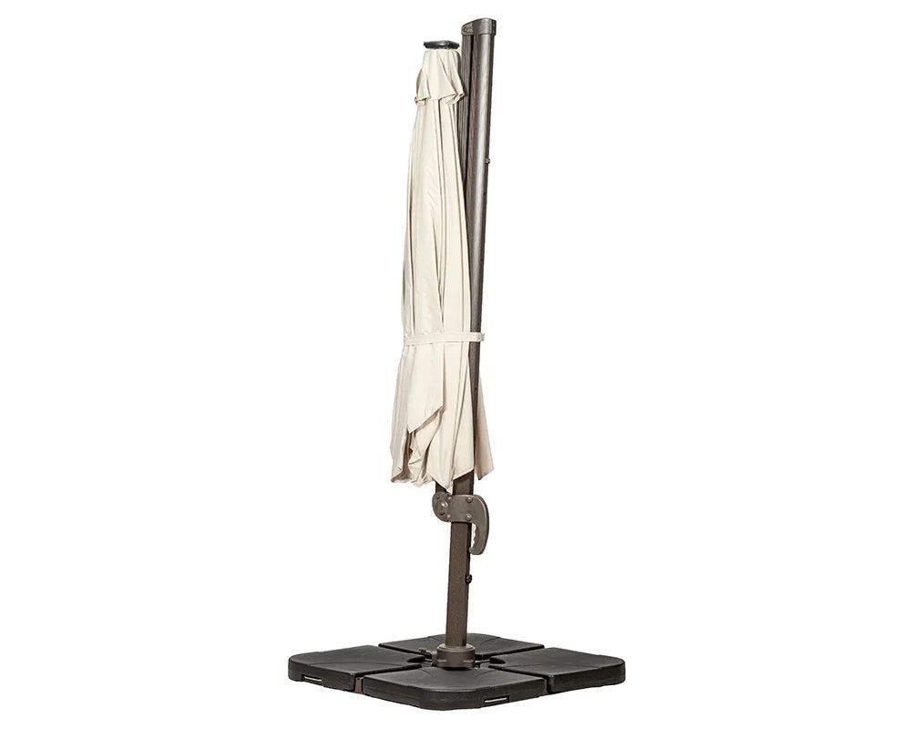 Beige cantilever garden parasol closed on black base, upright view