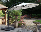Cream garden cantilever parasol with black frame on patio in landscaped backyard