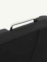 Textured black case with silver metal handle close up, durable storage solution detail