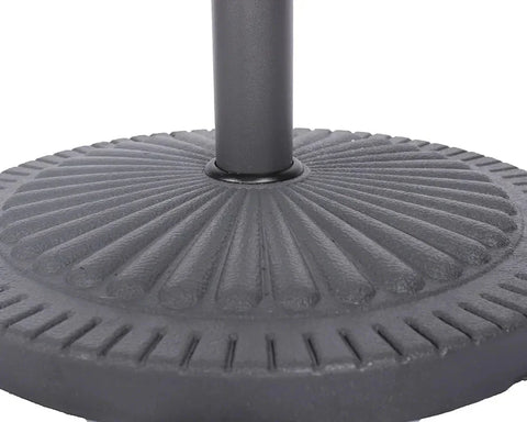 Round cast iron parasol base with textured radial pattern and central pole holder