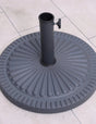 Round cast iron parasol base with ribbed pattern on tiled patio floor