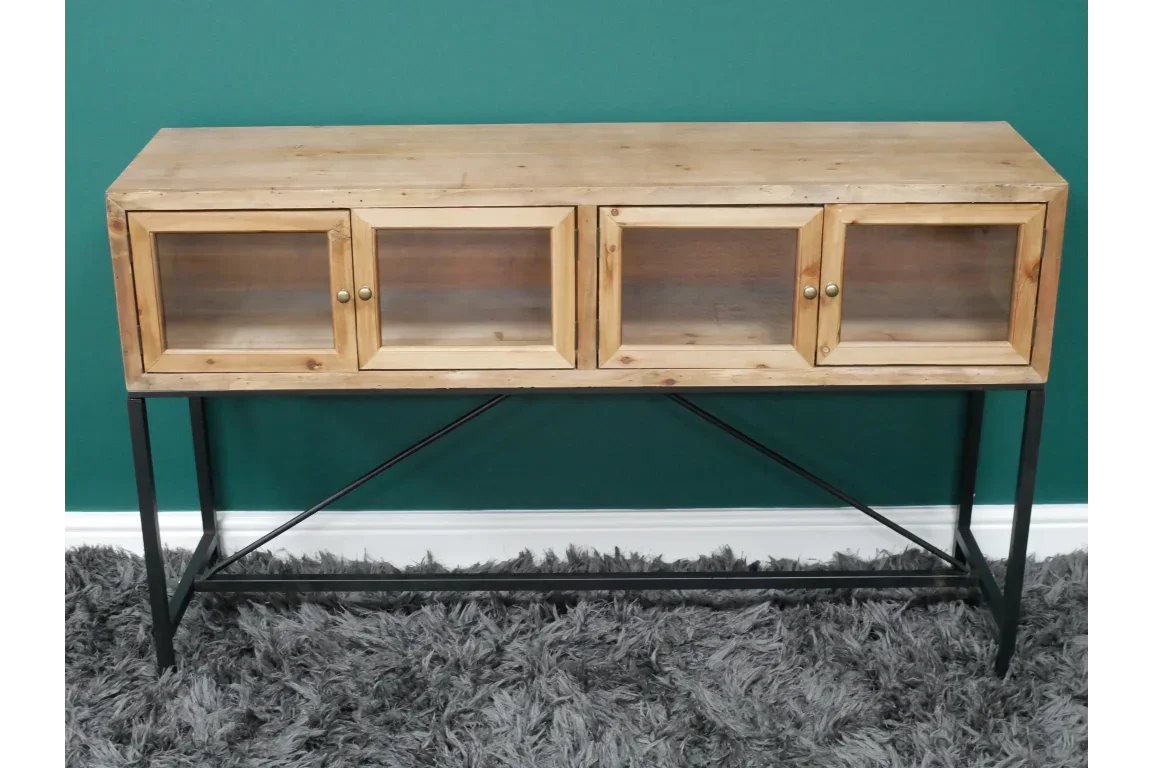 Rustic wooden sideboard with glass doors and black metal legs on grey rug
