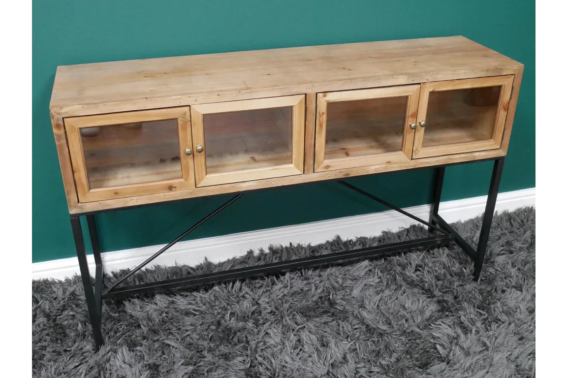 Wooden sideboard with glass doors and black metal legs on a grey rug