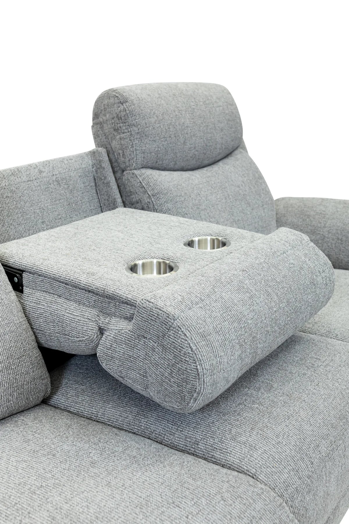Close-up of a light gray upholstered recliner chair with a folded center armrest featuring two stainless steel cup holders, shown against a white background.