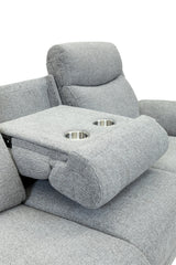 Close-up of a light gray upholstered recliner chair with a folded center armrest featuring two stainless steel cup holders, shown against a white background.