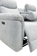 Close-up of a light gray textured recliner chair showing the side armrest, power control plaque, and extended footrest against a white background.